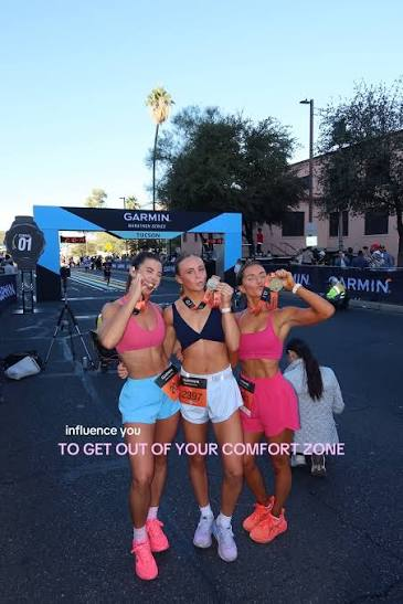 Runners celebrating with medals at the finish line